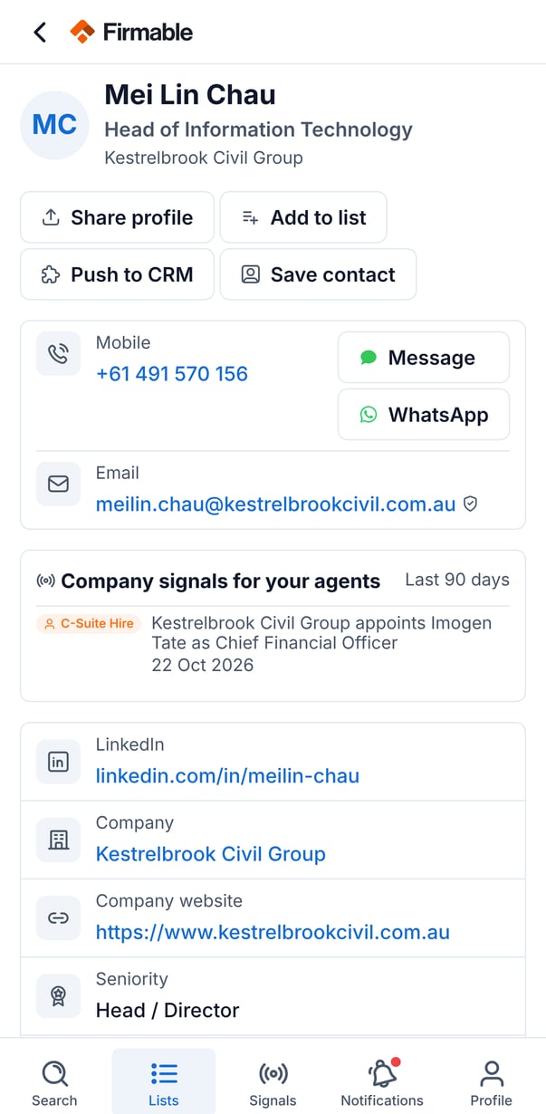 A people record with the mobile number revealed and Message and WhatsApp buttons